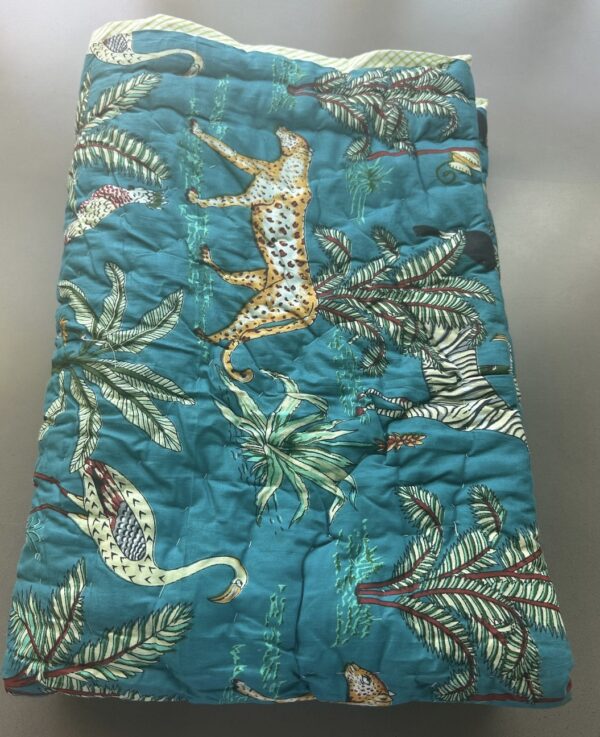 Blue children's quilt with jungle animal design