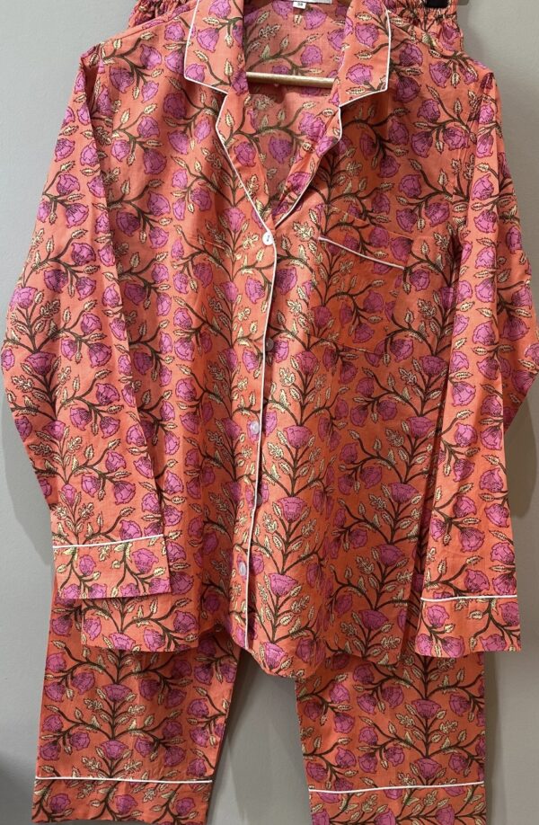 orange pyjama set with pink flower pattern
