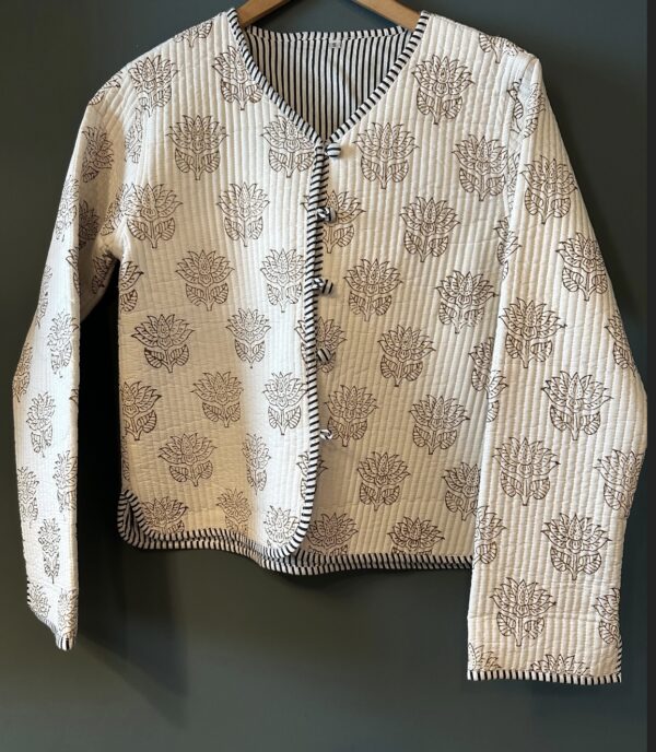 white jacket with black floral pattern